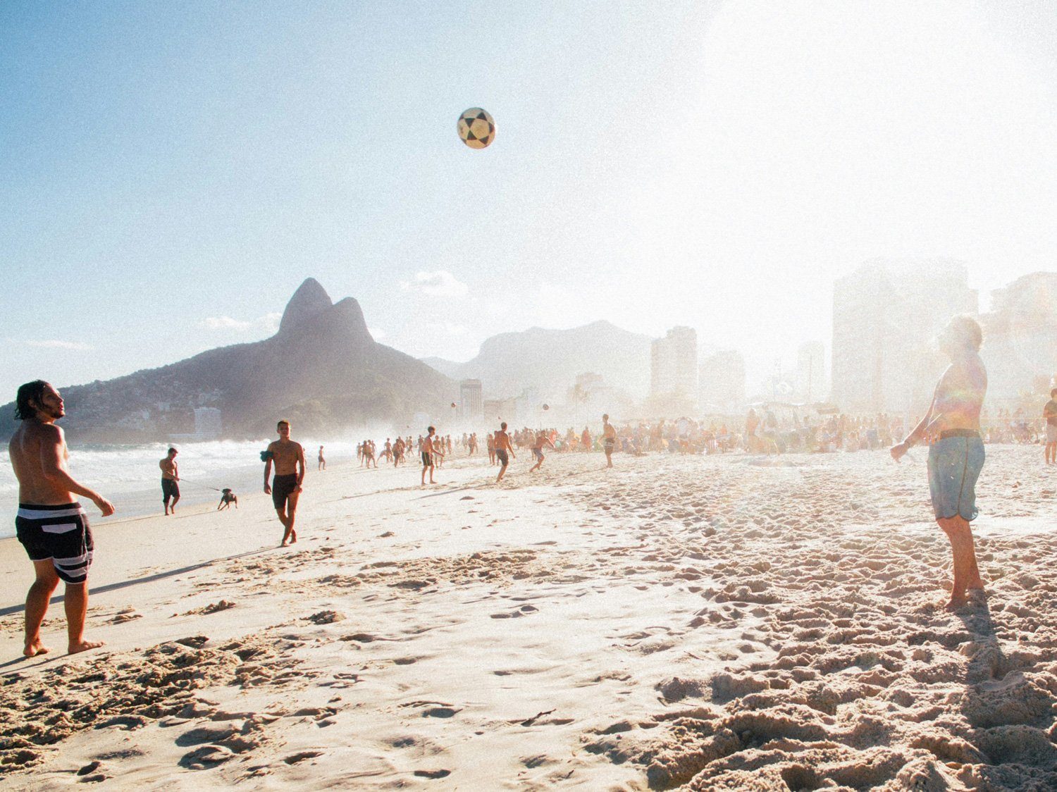 Everyday afternoon on an Ipanema beach with the Two Brothers mountains behind